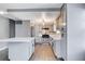 Modern kitchen featuring gray cabinets, stainless steel appliances, and a large island at 3971 Foxboro Cir, Las Vegas, NV 89121