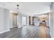 Modern kitchen with an island, grey cabinets and wood-look floors at 3971 Foxboro Cir, Las Vegas, NV 89121