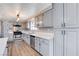 Updated kitchen boasts gray cabinets, stainless steel appliances, and ample counter space at 3971 Foxboro Cir, Las Vegas, NV 89121