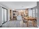 Renovated kitchen with grey cabinets, island, and wood flooring at 3971 Foxboro Cir, Las Vegas, NV 89121