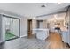 Updated kitchen with island, grey cabinets, and a view to the backyard at 3971 Foxboro Cir, Las Vegas, NV 89121