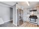 Stainless steel refrigerator and stove in a kitchen with gray cabinets at 3971 Foxboro Cir, Las Vegas, NV 89121