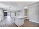 Open concept kitchen with island and living room views at 3971 Foxboro Cir, Las Vegas, NV 89121