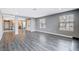 Open living room with hardwood floors and kitchen views at 3971 Foxboro Cir, Las Vegas, NV 89121