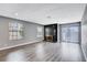 Bright living room featuring hardwood floors and a fireplace at 3971 Foxboro Cir, Las Vegas, NV 89121