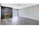 Spacious living room with hardwood floors and a fireplace at 3971 Foxboro Cir, Las Vegas, NV 89121