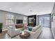 Living room with fireplace and furniture staging at 3971 Foxboro Cir, Las Vegas, NV 89121