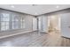 Spacious main bedroom with hardwood floors and access to bathroom at 3971 Foxboro Cir, Las Vegas, NV 89121