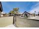 Private patio with wrought iron gate and complex view at 3971 Foxboro Cir, Las Vegas, NV 89121
