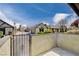 Private patio with wrought iron gate and view of complex at 3971 Foxboro Cir, Las Vegas, NV 89121