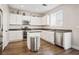 Modern kitchen with stainless steel appliances and white cabinets at 618 Lava Beds Way, North Las Vegas, NV 89084