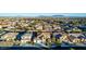 Aerial view of neighborhood with two story house and mountain views at 6440 Bright Morning St, North Las Vegas, NV 89084