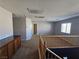 Spacious loft area with wood railing and carpet flooring at 6524 Heavenly Moon St, North Las Vegas, NV 89084