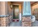 Inviting front entrance with stone accents and a welcoming porch at 7234 Regent Pond St, Las Vegas, NV 89166