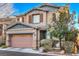 Two-story house with attached garage and landscaping at 7234 Regent Pond St, Las Vegas, NV 89166