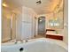 Spa-like bathroom with a large soaking tub and shower at 7632 Highland Pony St, Las Vegas, NV 89149