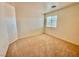 Well-lit bedroom with neutral walls and carpet at 7632 Highland Pony St, Las Vegas, NV 89149