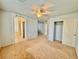 Spacious bedroom with ceiling fan and en-suite bathroom at 7632 Highland Pony St, Las Vegas, NV 89149