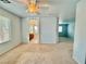 Bright bedroom with ceiling fan and access to bathroom at 7632 Highland Pony St, Las Vegas, NV 89149