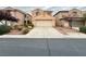 Two-story house with attached garage and landscaping at 7632 Highland Pony St, Las Vegas, NV 89149