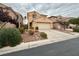Two-story house with attached garage and landscaping at 7632 Highland Pony St, Las Vegas, NV 89149