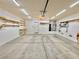 Spacious garage with storage shelving and overhead door at 7632 Highland Pony St, Las Vegas, NV 89149