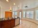 Kitchen with island, stainless steel appliances, and view to backyard at 7632 Highland Pony St, Las Vegas, NV 89149