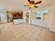 Kitchen with dark wood cabinets and island at 7632 Highland Pony St, Las Vegas, NV 89149