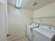 Laundry room with washer, dryer, and shelving at 7632 Highland Pony St, Las Vegas, NV 89149