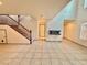 Open living area with tile floors and staircase at 7632 Highland Pony St, Las Vegas, NV 89149