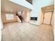 Living room with tile floors and a fireplace at 7632 Highland Pony St, Las Vegas, NV 89149