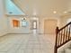 Open living area with tile floors and views to kitchen at 7632 Highland Pony St, Las Vegas, NV 89149