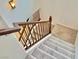 Elegant wooden staircase with carpeted steps at 7632 Highland Pony St, Las Vegas, NV 89149