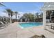 Community pool with lounge chairs and shaded seating at 805 Dana Hills Ct # 104, Las Vegas, NV 89134