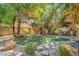 Landscaped backyard with putting green at 8170 W Red Coach Ave, Las Vegas, NV 89129