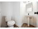 Simple bathroom with pedestal sink and toilet at 886 Park Walk Ave, Las Vegas, NV 89123