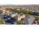 Aerial view showcasing neighborhood homes and mountain views at 9085 Bridal Creek Ave, Las Vegas, NV 89178