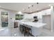 Modern kitchen with white cabinets, stainless steel appliances, and an island at 9085 Bridal Creek Ave, Las Vegas, NV 89178