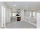 Loft hallway with white railing and carpeted floor at 9085 Bridal Creek Ave, Las Vegas, NV 89178