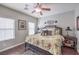 Spacious bedroom with floral bedding and ceiling fan at 9113 Sea Mink Ave, Las Vegas, NV 89149