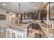 Modern kitchen with granite countertops and dark brown cabinets at 9113 Sea Mink Ave, Las Vegas, NV 89149