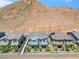 Aerial view of houses with walkway and mountain backdrop at 92 Kimberlite Dr, Henderson, NV 89011