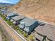 Aerial view of houses on hillside with mountain background at 92 Kimberlite Dr, Henderson, NV 89011