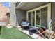 Private backyard with artificial turf and seating area at 92 Kimberlite Dr, Henderson, NV 89011