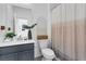 Clean bathroom with a toilet, shower, and vanity at 92 Kimberlite Dr, Henderson, NV 89011