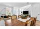 Bright dining area with wood table and woven chairs near the kitchen at 92 Kimberlite Dr, Henderson, NV 89011