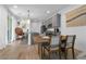 Dining area with wood table, woven chairs, and view into the kitchen at 92 Kimberlite Dr, Henderson, NV 89011