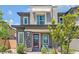 Modern two-story home with gray siding, red door, and landscaping at 92 Kimberlite Dr, Henderson, NV 89011