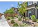 Landscaped front yard with walkway and mature trees at 92 Kimberlite Dr, Henderson, NV 89011