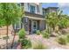 Landscaped front yard with walkway and mature trees at 92 Kimberlite Dr, Henderson, NV 89011